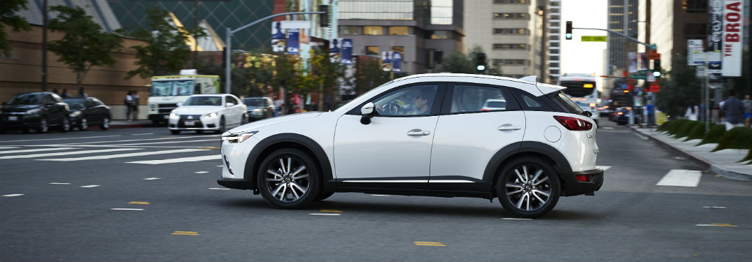 2018 Mazda CX-3 exterior driver side profile crossing intersection on city road