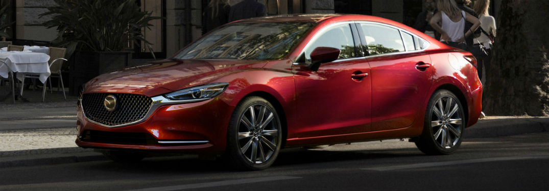 2018 Mazda6 exterior front fascia and drivers side with group of people on sidewalk