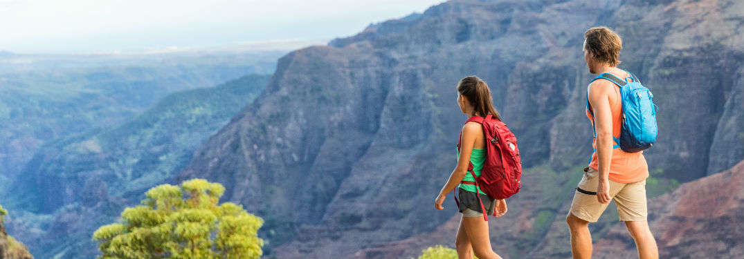 2 hikers hiking in mountains