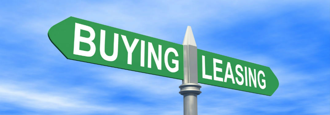 Street sign with buying and leasing spelled out on it