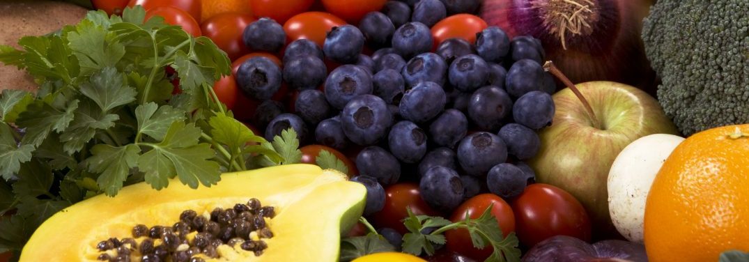 Healthy organic vegetables and fruits as background