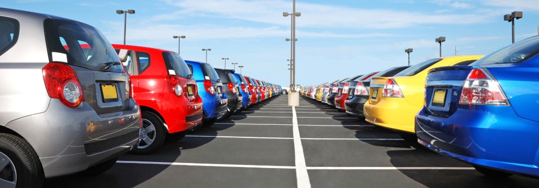 Rear angle of cars parked in a parking lot
