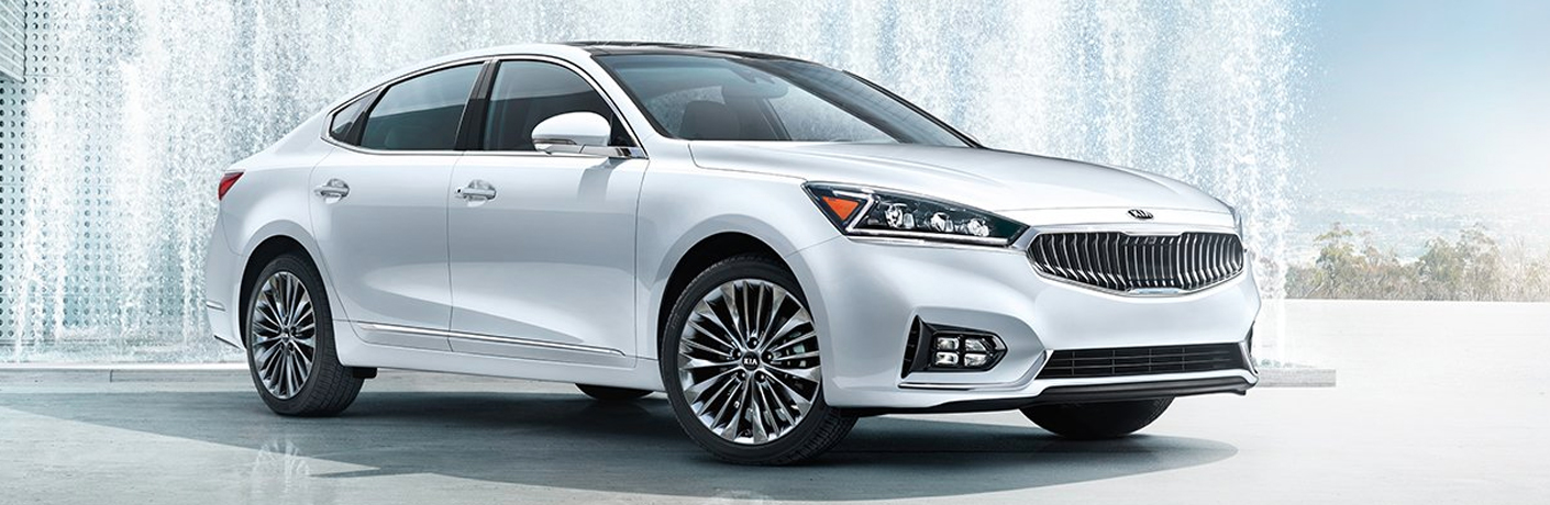 white kia cadenza in the snow