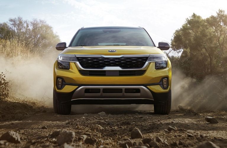 2021 Kia Seltos exterior front while driving on rocky road