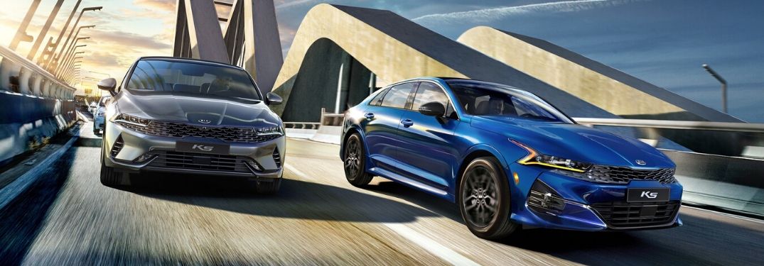 Gray and Blue 2020 Kia K5 Models on a Bridge