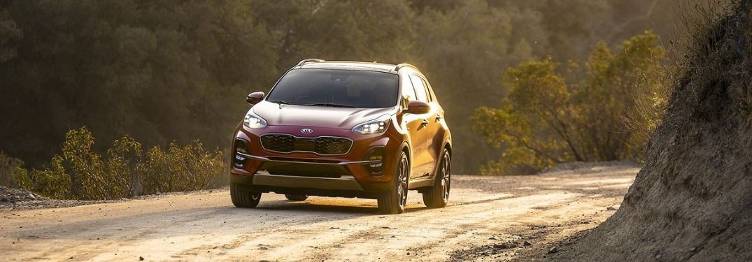 Red 2021 Kia Sportage on Dirt Road