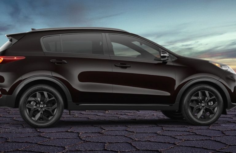 Black 2021 Kia Sportage Nightfall Edition Side Exterior in a Desert