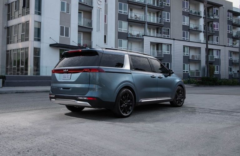 Blue 2022 Kia Carnival Rear Exterior in a Parking Lot