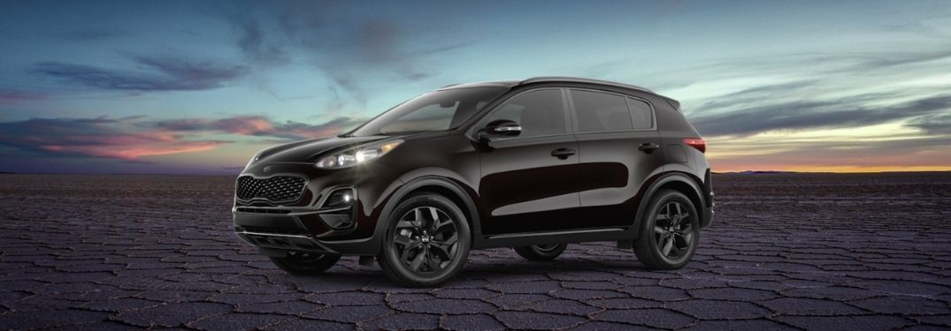 Black 2021 Kia Sportage Nightfall Edition Front Exterior in a Desert