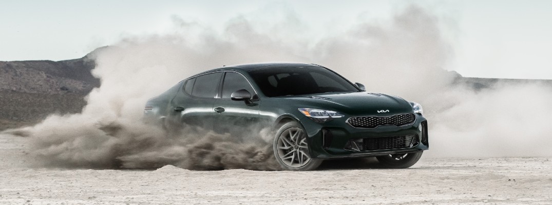 A photo of the 2022 Kia Stinger kicking up dust.
