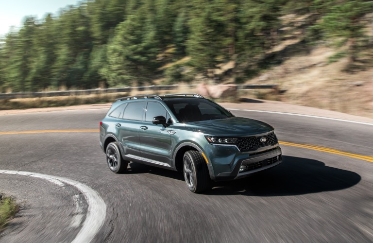 The 2021 Kia Sorento coming around a corner.