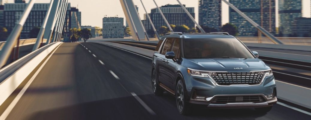 2022 Kia Carnival MPV on a Bridge