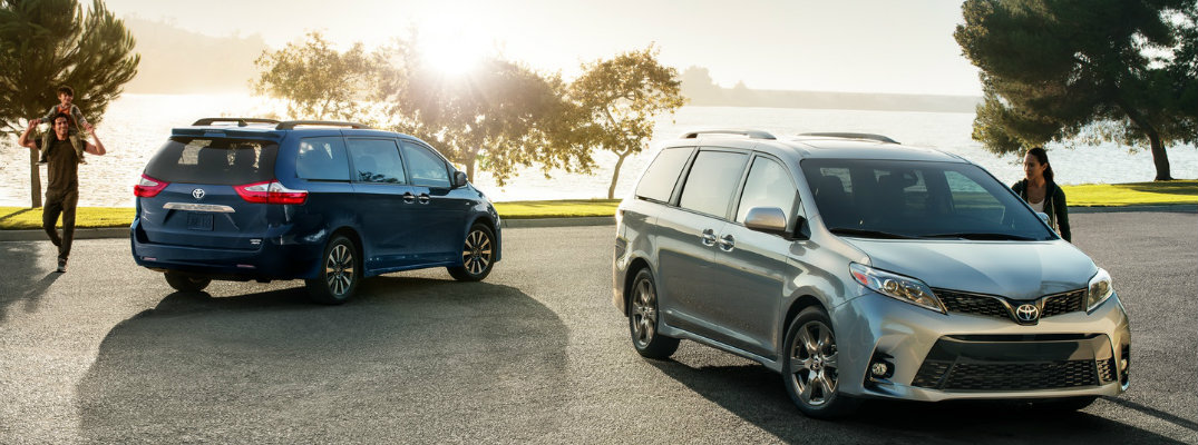 Blue and silver 2018 Toyota Sienna models parked in front of lake