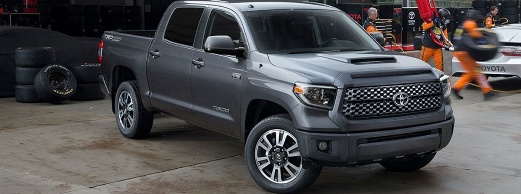 2018 Toyota Tundra parked with pit crew running behind it