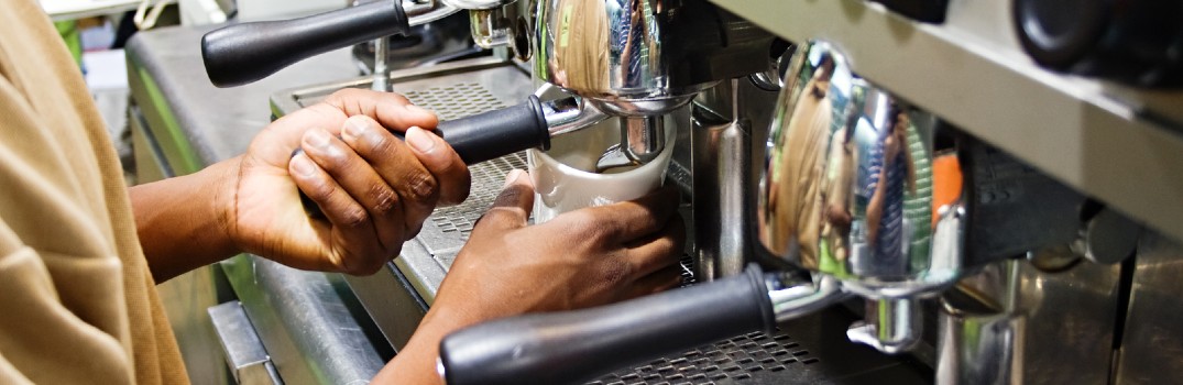 barista brewing coffee