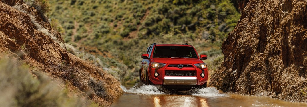 red 2020 Toyota 4Runner driving through water