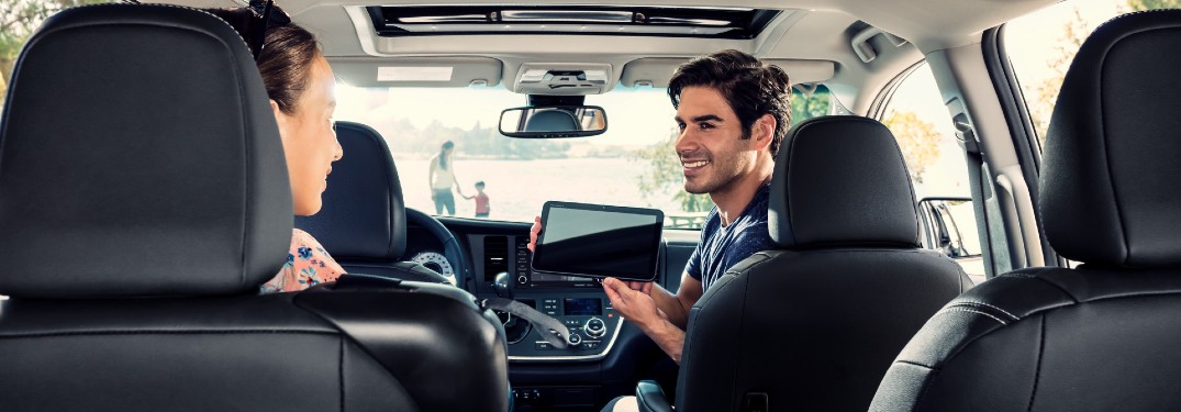 man using technology features inside the 2020 Toyota Sienna