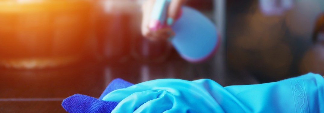 someone cleaning vehicle with blue gloves
