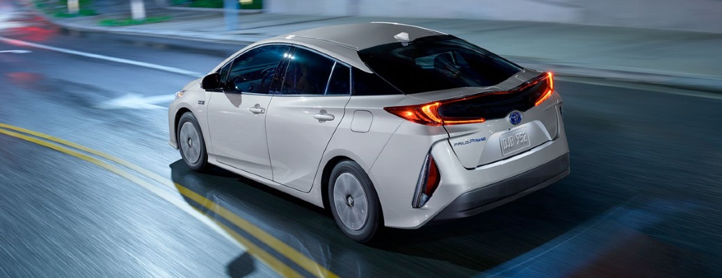 2020 Toyota Prius Prime driving in the city at night