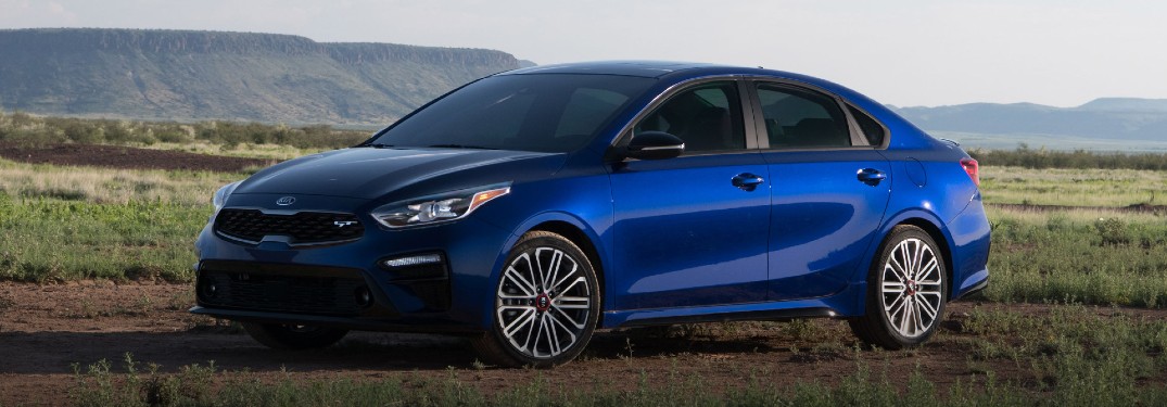 Front driver angle of a blue 2021 Kia Forte