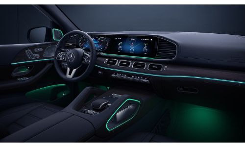 2020 Mercedes-Benz GLE SUV interior shot showing ambient lighting green and large touchscreen display and steering wheel