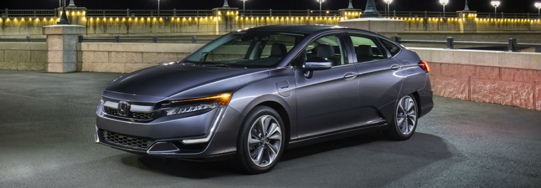 left side angled view of parked gray honda clarity