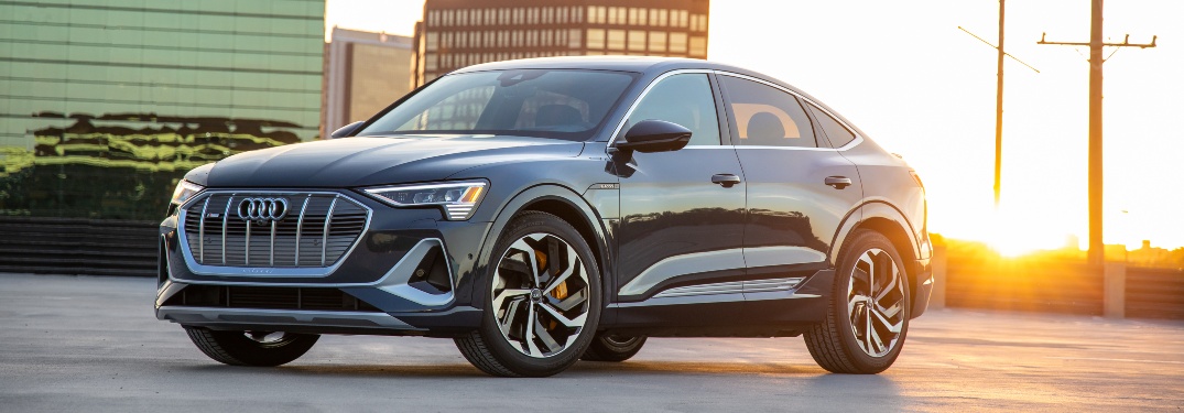 2020 e-tron parked in front of setting sun