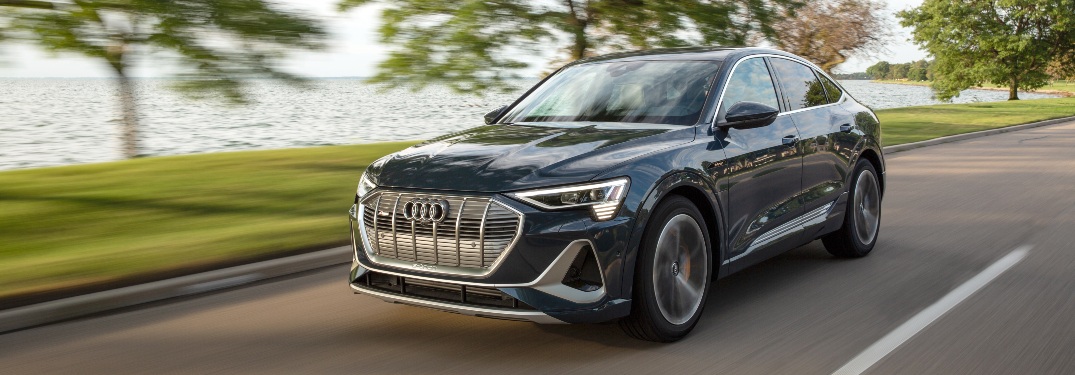 2020 e-tron driving by waterfront