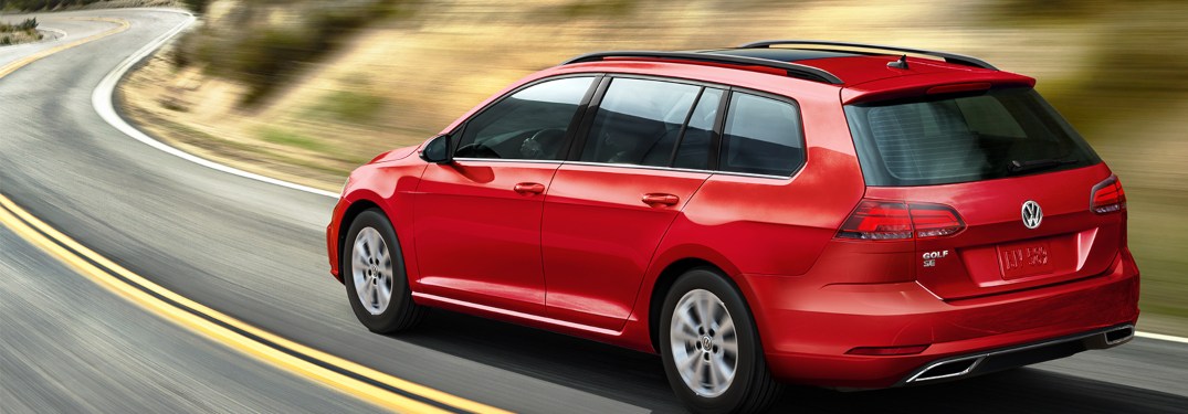 2019 Volkswagen Golf SportWagen driving down a winding road