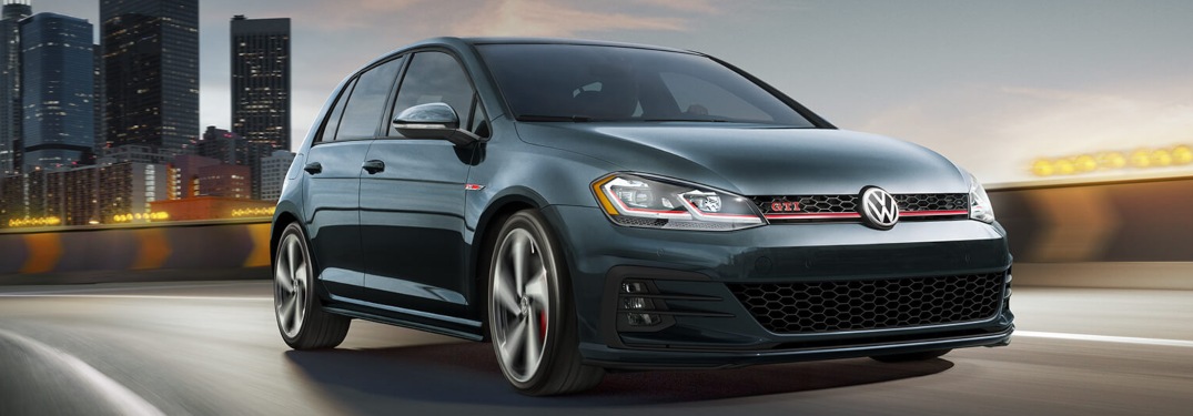 2019 Volkswagen Golf GTI driving down a highway