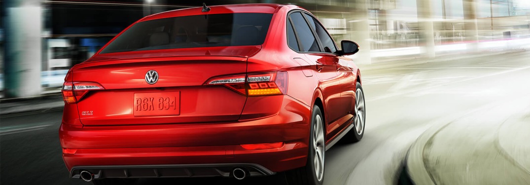 2019 Volkswagen Jetta GLI driving down a winding highway road