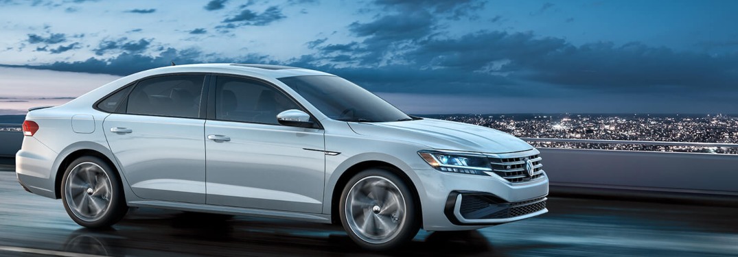 2020 Volkswagen Passat driving down a highway at night