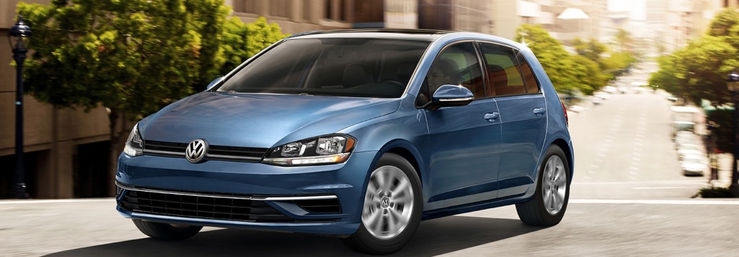 2020 Volkswagen Golf driving down a city street