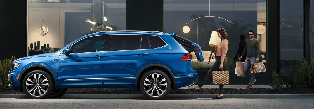 A woman putting cargo inside a 2020 Volkswagen Tiguan
