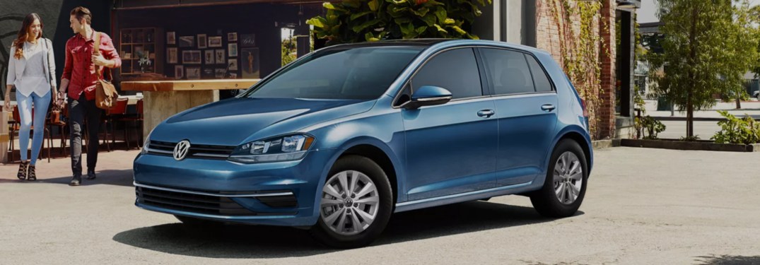 2021 Volkswagen Golf parked in front of a market