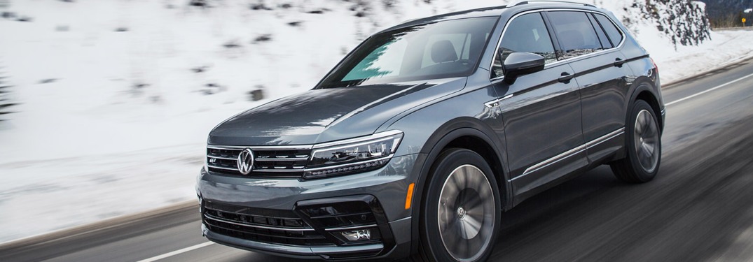 2021 Volkswagen Tiguan driving down a winter road
