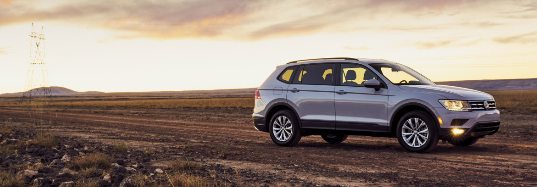 2018 Volkswagen Tiguan parked in a dirt field at sunset