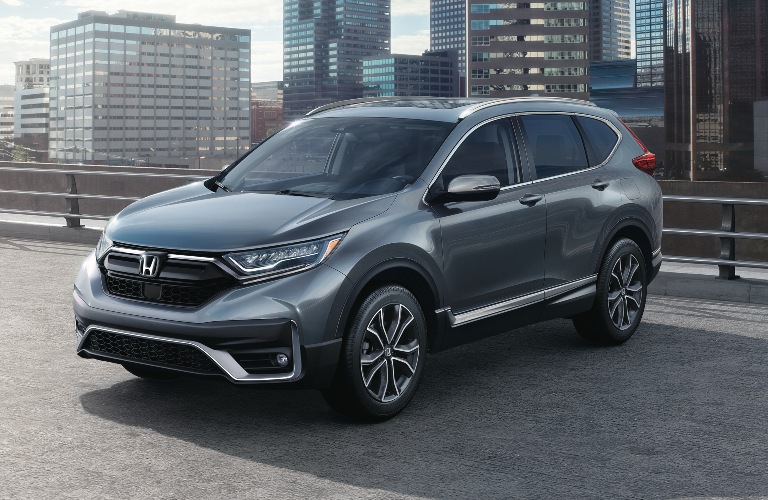 2020 Honda CR-V parked in front of skyscrapers
