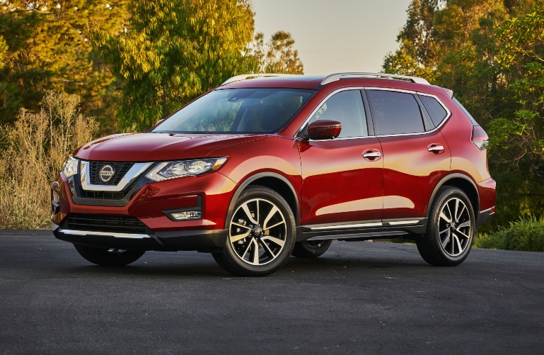 2020 Nissan Rogue with green and yellow trees
