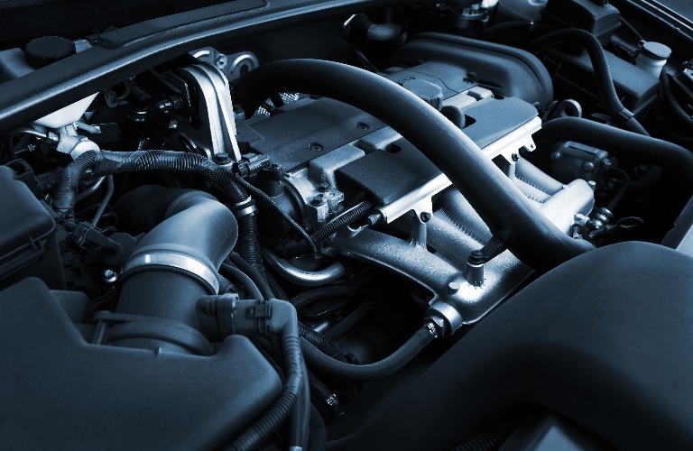 An engine under the hood of a vehicle