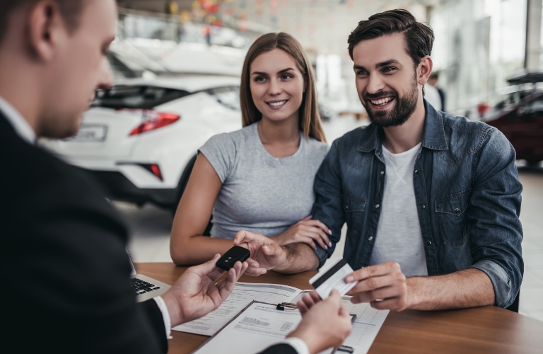 Couple at Car Dealership