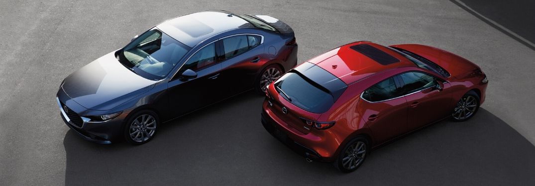 Overhead View of Gray 2020 Mazda3 Sedan and Red 2020 Mazda3 Hatchback in a Parking Lot