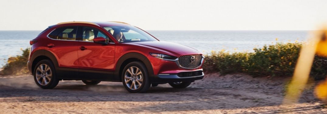 Red 2021 Mazda CX-30 on a Beach