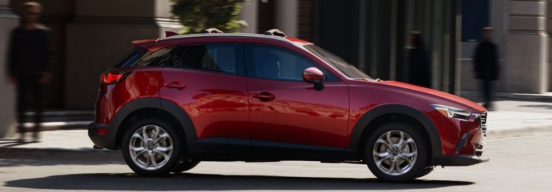 Red 2021 Mazda CX-3 Side Exterior on a City Street