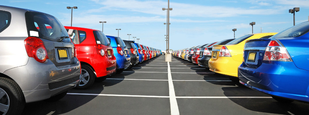 Rows of cars and SUVs on a dealership lot