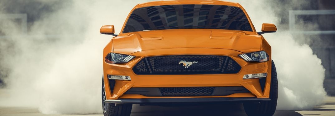 2020 Ford Mustang doing a burnout seen from the front