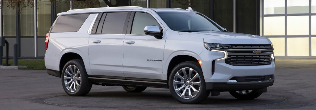 Passenger's side front angle view of white 2021 Chevrolet Suburban