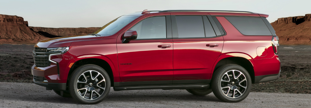 Red 2021 Chevrolet Tahoe with mesas in the background