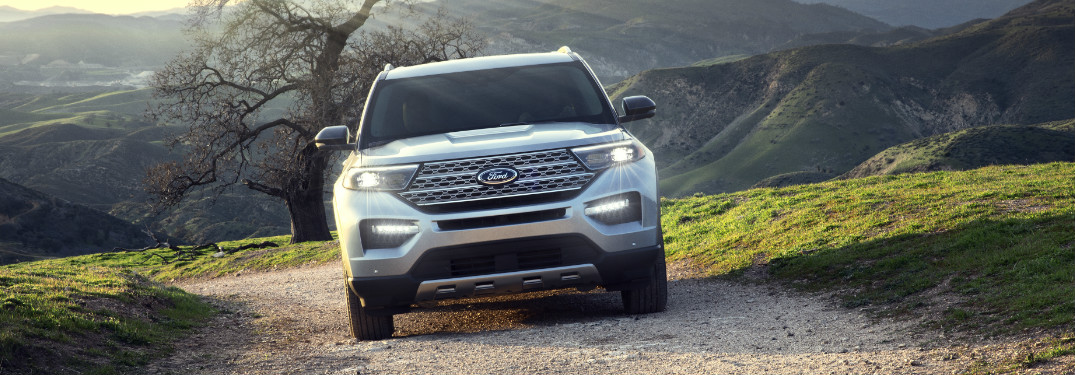 Silver 2020 Ford Explorer driving on a gravel road