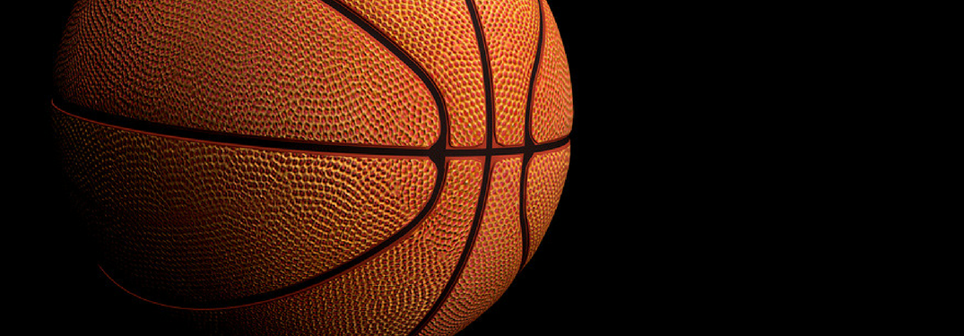 Closeup of a basketball on a black background